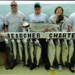 Captain Chas with Friends fishing on Searcher Charter Boat